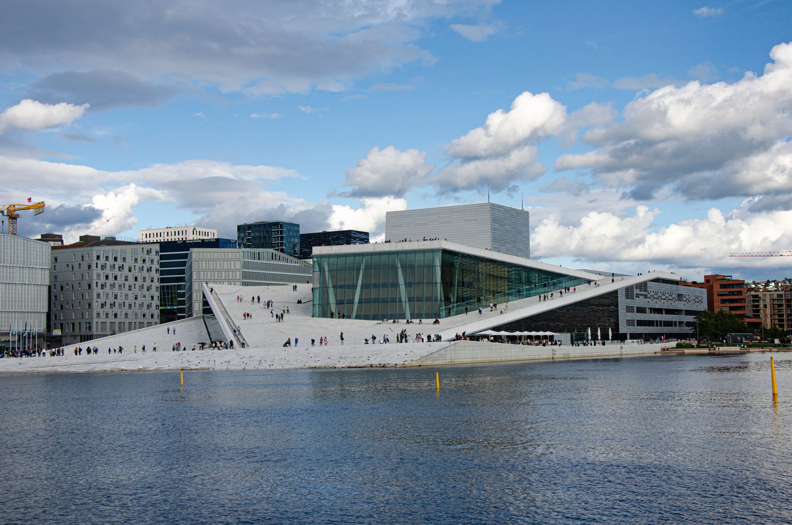 Oslo Opera House on the waterfront under a blue sky - salaries in Norway 2026