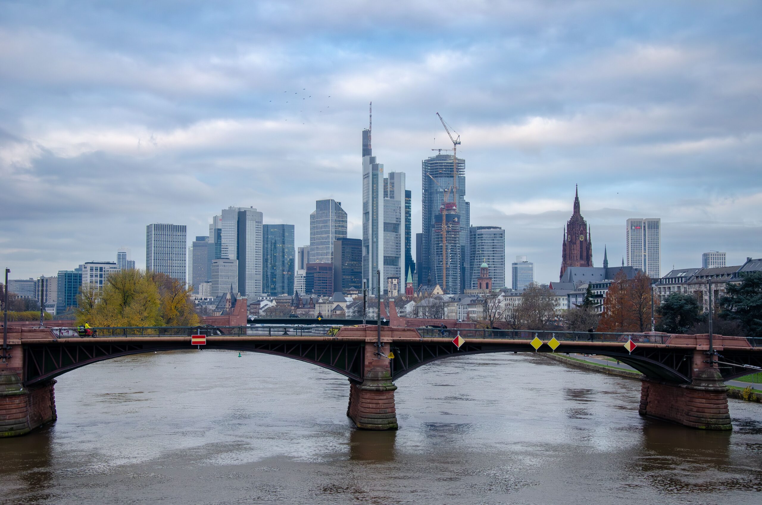 Frankfurt am Main skyline behind a bridge over the river - Germany work permit and EU Blue Card