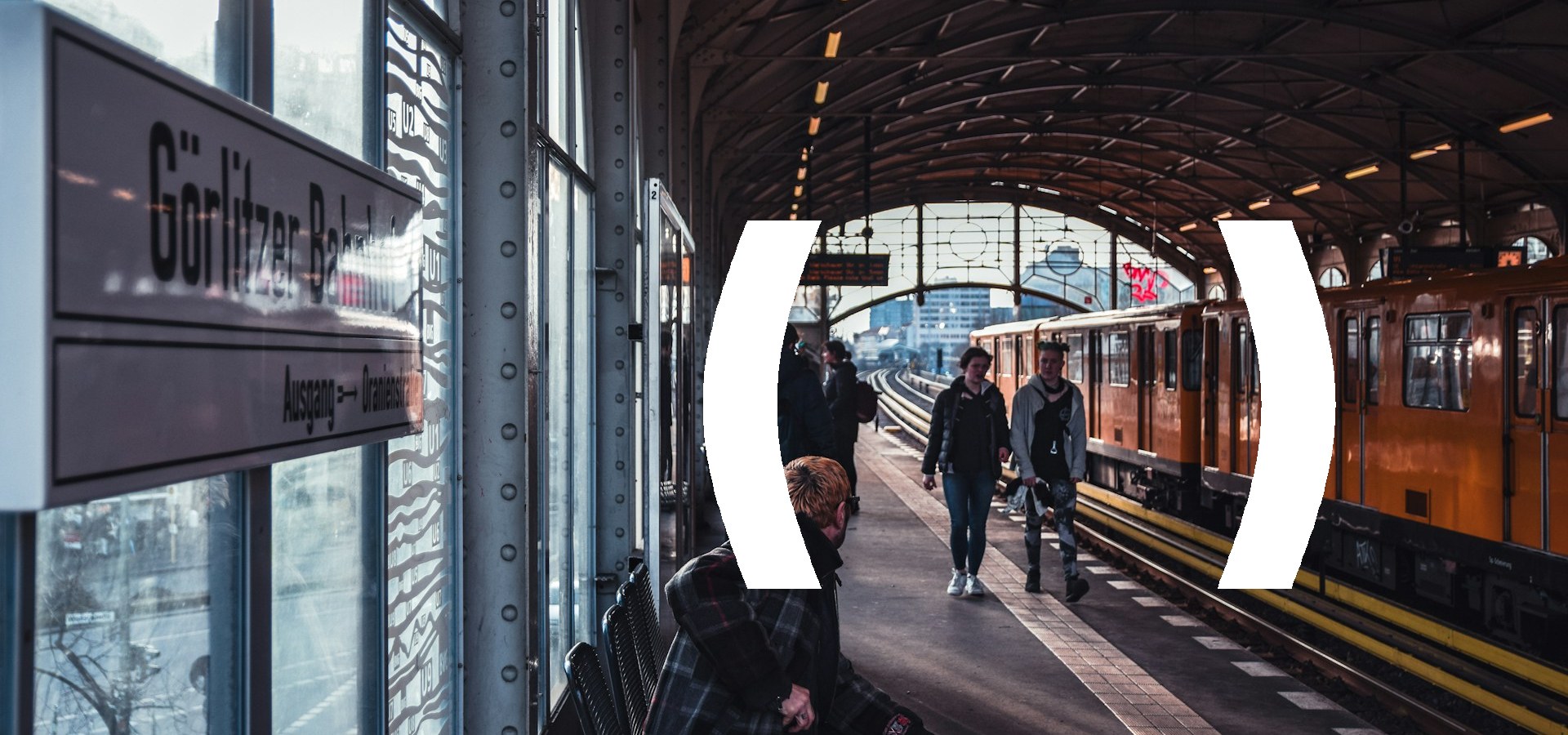 Travellers walking along a European railway station platform